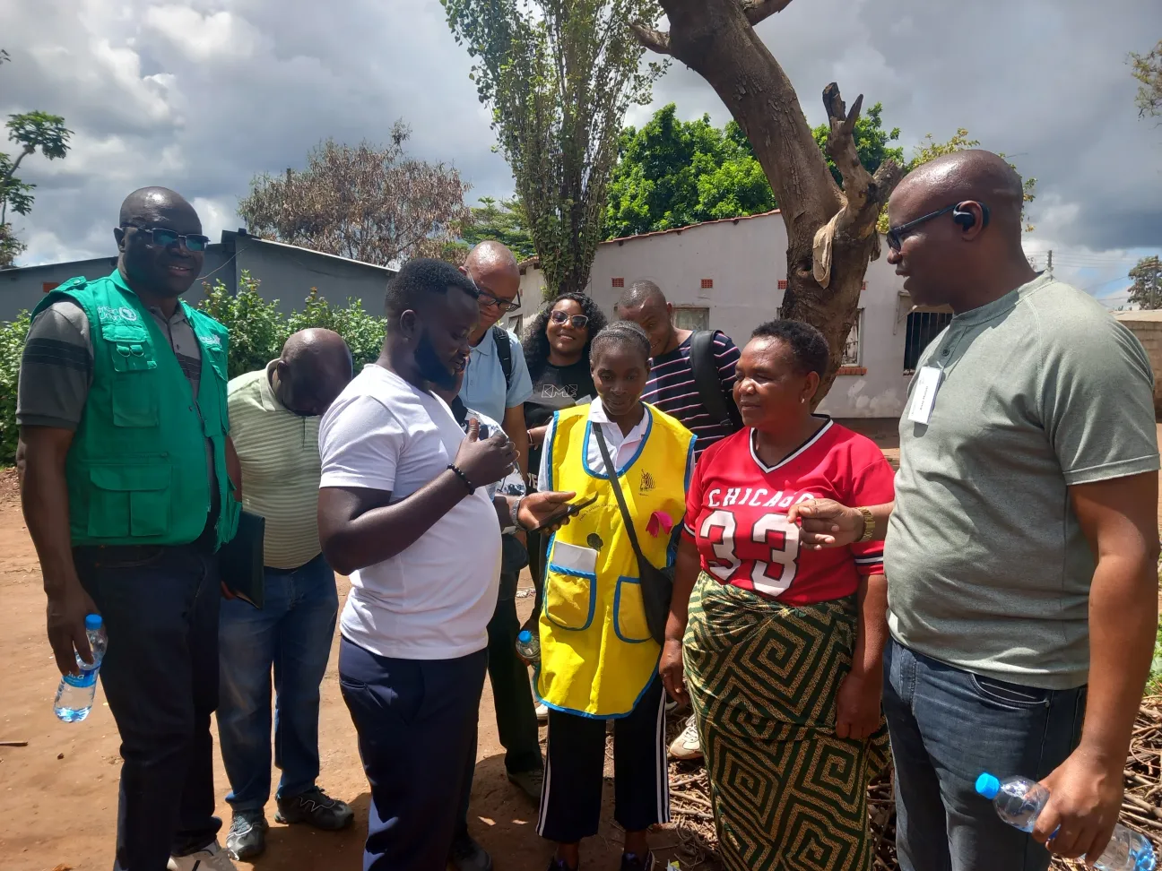 Testing the EBS mobile application in the field: surveillance officers and a community healthcare volunteer record a health signal in Lusaka.