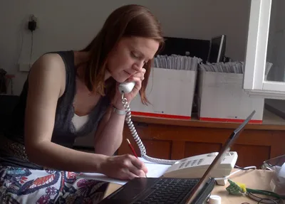 EPIET Postcard from the field  - EPIET fellow Anna Zelicka Hardy talking on the phone, during outbreak investigation