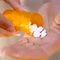 Pills in hand. © Istock