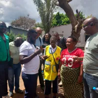 Testing the EBS mobile application in the field: surveillance officers and a community healthcare volunteer record a health signal in Lusaka.