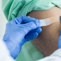 Vaccination by doctor wearing gloves