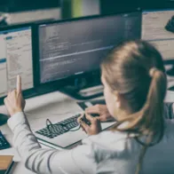 experts looking at a computer screen