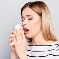 Sick woman coughing