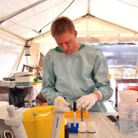 Doctor in a laboratory, in the field, during Ebola mission