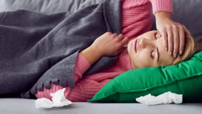 Sick woman holding her head