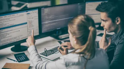 experts looking at a computer screen