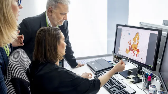 Experts looking at map