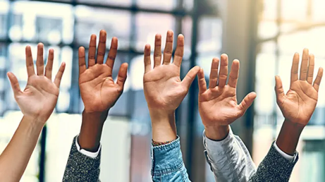 Raising hands. ©Istock