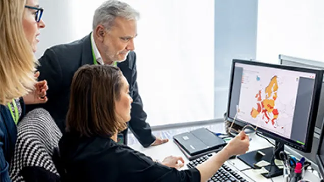 Surveillance experts looking at data