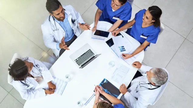 Doctors around table visible from above
