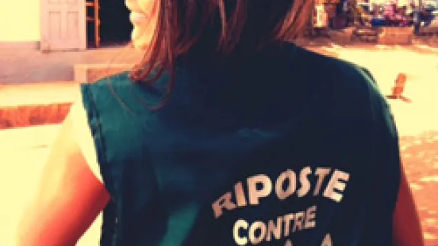 EPIET Postcard from the field - EPIET Fellow Cristina, deployed to Guinea during Ebola outbreak, with a t-shirt saying "Riposte contre Ebola"