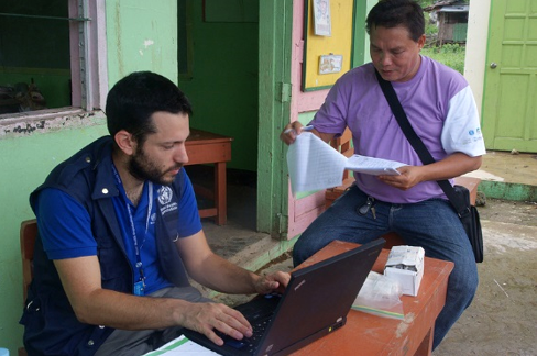 EPIET Postcard from the field - EPIET fellow Michael Edelstein writing down, while working with a colleague