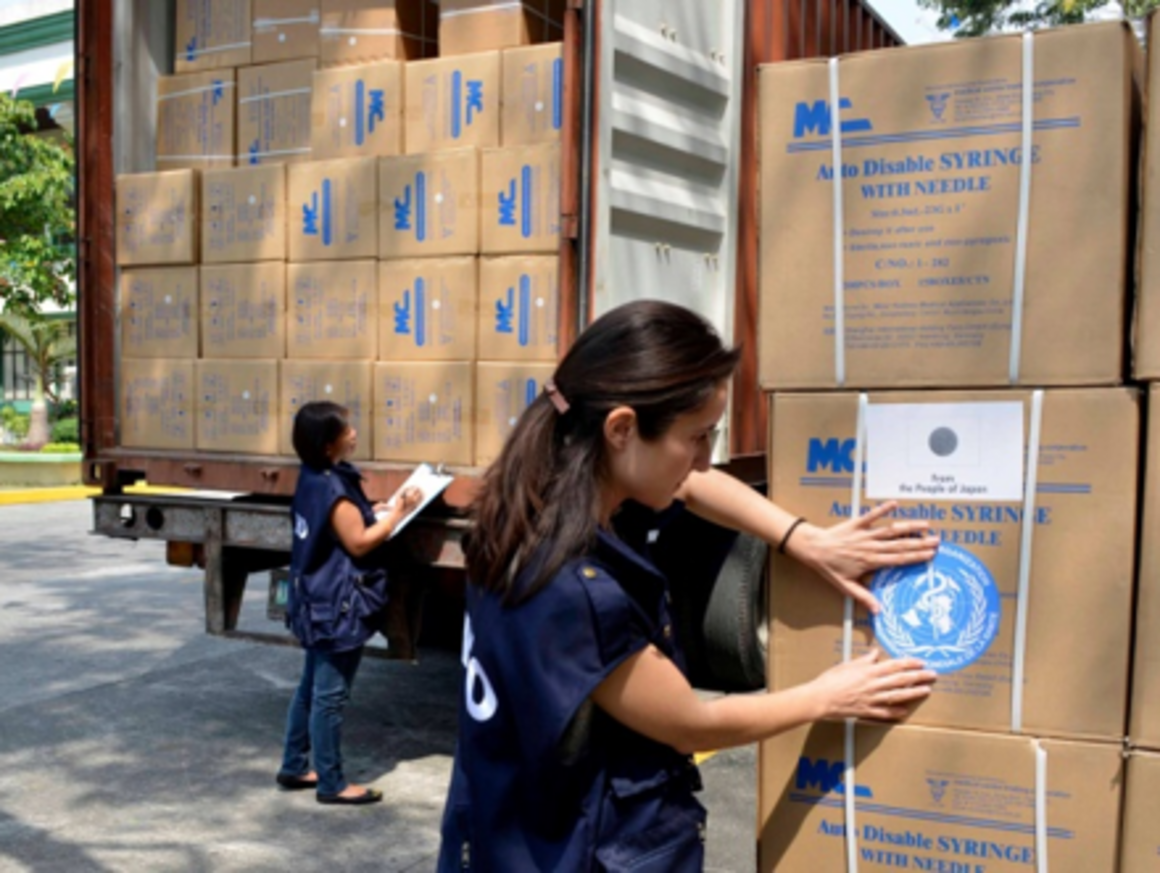 EPIET Postcard from the field - EPIET fellow Vanessa Cozza marking with the UN sign, boxes with humanitarian aid materials