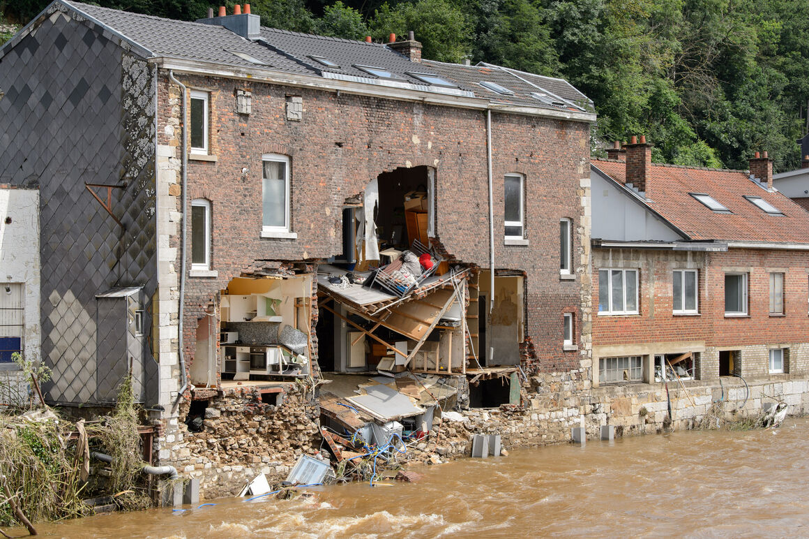 House with collapsed wall after flood in Belgium.