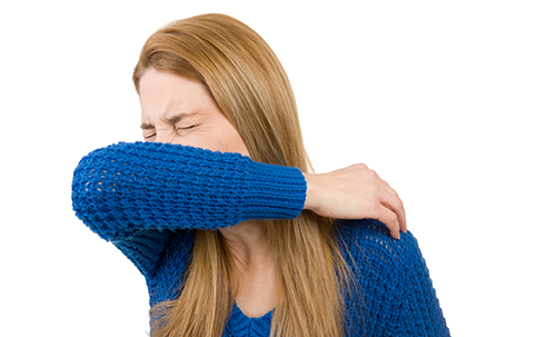 Sick woman sneezing