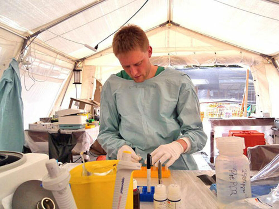 Doctor in a laboratory, in the field, during Ebola mission