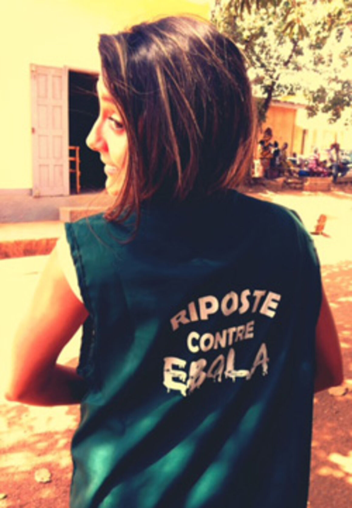 EPIET Postcard from the field - EPIET Fellow Cristina, deployed to Guinea during Ebola outbreak, with a t-shirt saying "Riposte contre Ebola"