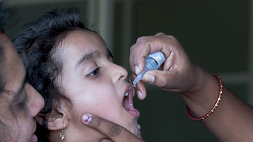 Child receiving polio vaccination 